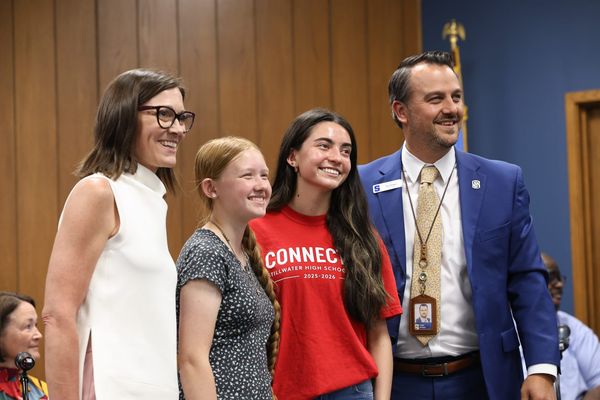 From left, teacher Jody Webber, FCCLA state champions Laura Bennett and Emma Cantu, and Superintendent Tyler Bridges at the Stillwater Board of Education meeting April 14, 2026.