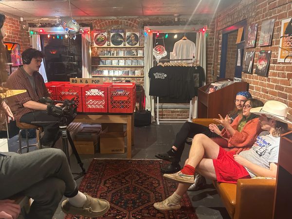 OSU Filmmakers Association member William Mantzel films Ugly Cowboys members Ben Lokuta, Bee McAdoo and Sam Miess on a couch at Velvet Fudge.
