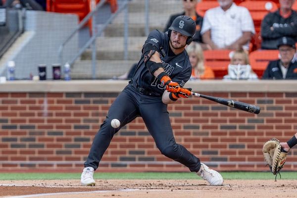 Oklahoma State slugger Kollin Ritchie makes contact at the plate against TCU on May 1, 2026, at O'Brate Stadium. Ritchie hit three home runs in a 7-6 Cowboys win.