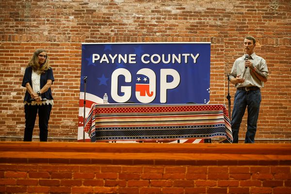 Payne County Commissioner Rhonda Markum and challenger Clayton Estus stand on stage at the Payne County GOP candidate forum on June 11, 2026, at the Stillwater Community Center in Stillwater.