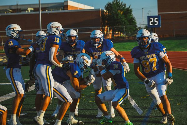 Stillwater senior Dian Fix (16) celebrates with teammates after his interception return for a touchdown against Fayetteville on Aug. 28, 2026, at Pioneer Stadium in Stillwater.