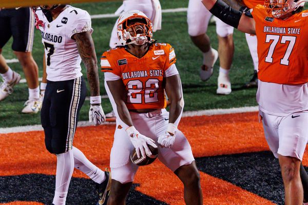 OSU running back William Mason celebrates in the end zone after a touchdown run against Colorado on Oct. 24, 2026, at Boone Pickens Stadium as lineman Ashton Lepo raises his arms.