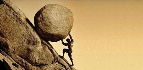 Man holding back a huge boulder on a steep side of a mountain.