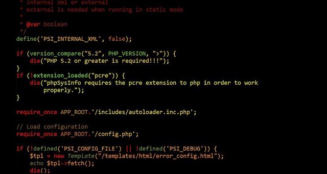 Black screen with computer coding in red, green, and yellow.