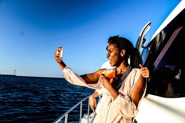 Nichole Bestman on boat taking a selfie.