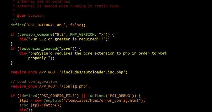 Black screen with computer coding in red, green, and yellow.