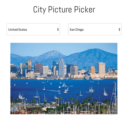 City Picture App - city and skyscrapers on water way backed by mountains.