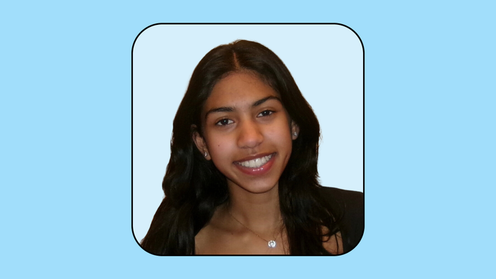 A headshot of Aanya Shah on a light blue background.