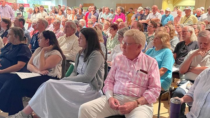 Packed house, same debate