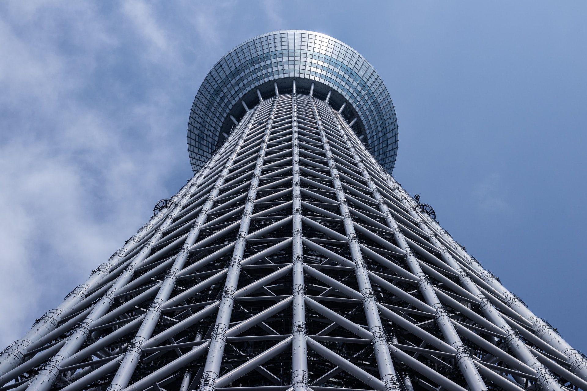 Skytree Tower in Tokyo. Looking up the tower from its base, structural elements visible
