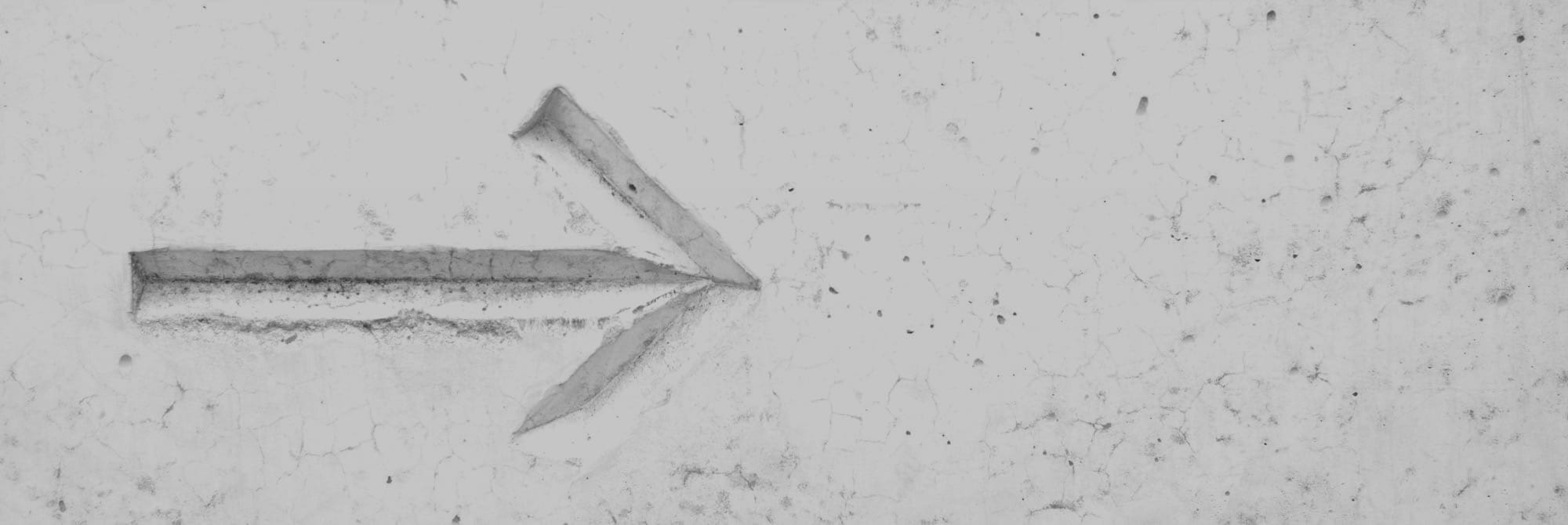 right arrow sign on wall