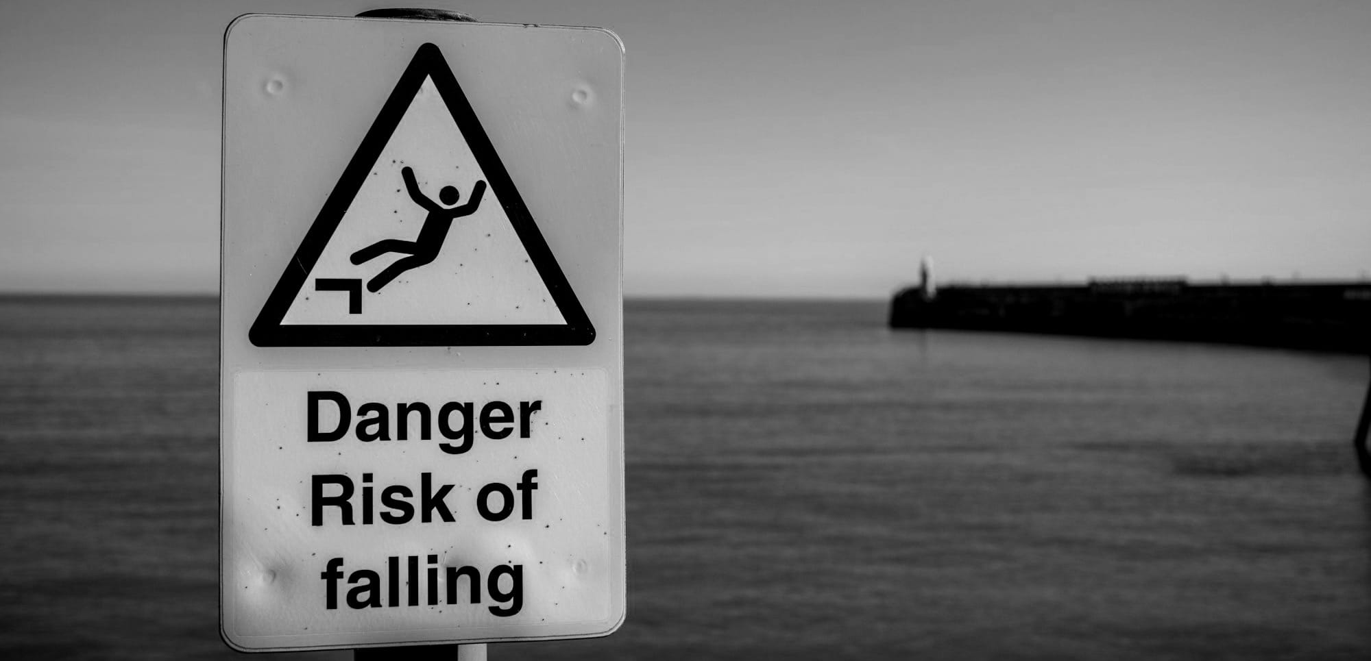 a sign warning of a danger of falling