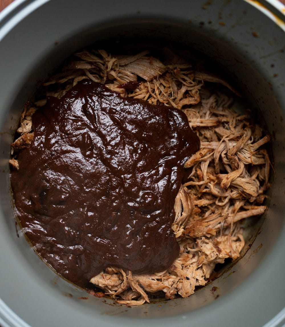 Overhead shot of reduced Texas pulled pork sauce added to the shredded pork