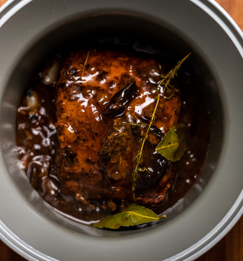 Overhead shot of Texas pulled pork in a slow cooker after cooking