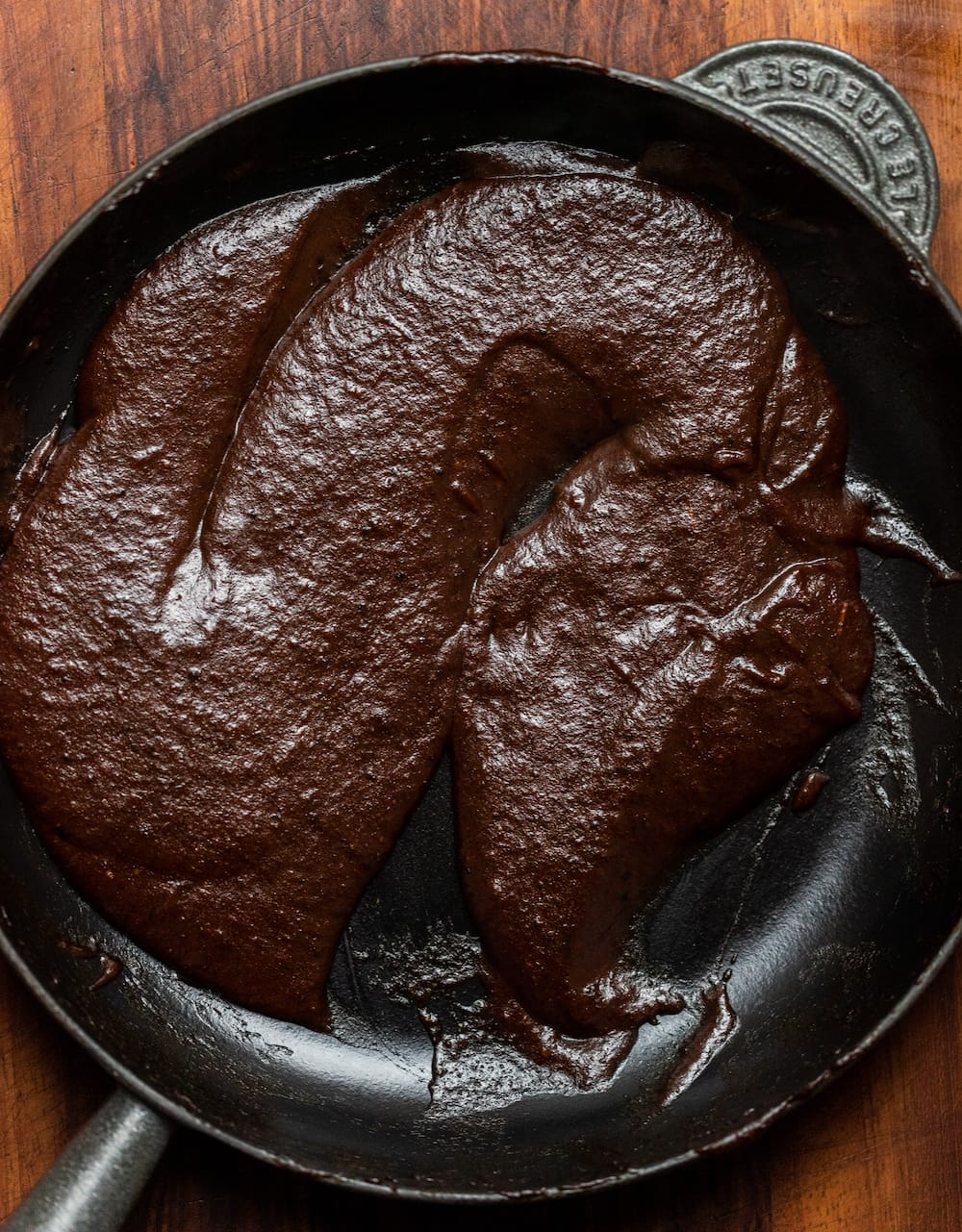 Overhead shot of Texas pulled pork sauce in a cast iron after reducing