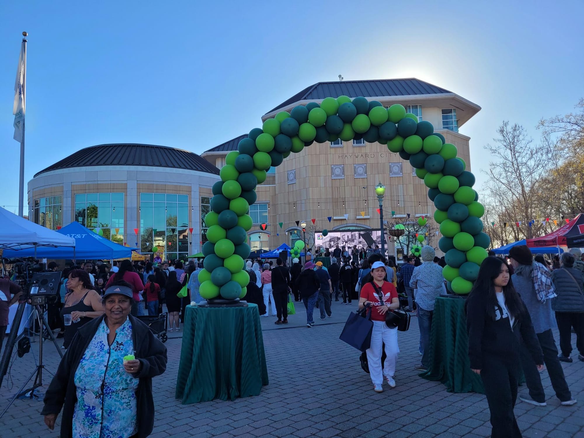 Photograph of people enjoying Hayward's 150th birthday party near City Hall.
