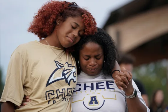Mourners attend a vigil after a shooting at Apalachee High School in Winder, Ga., on Sept. 4, 2024. Elijah Nouvelage / Reuters