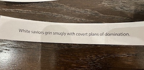 White saviors grin smugly and make plans of world domination - black words on white paper