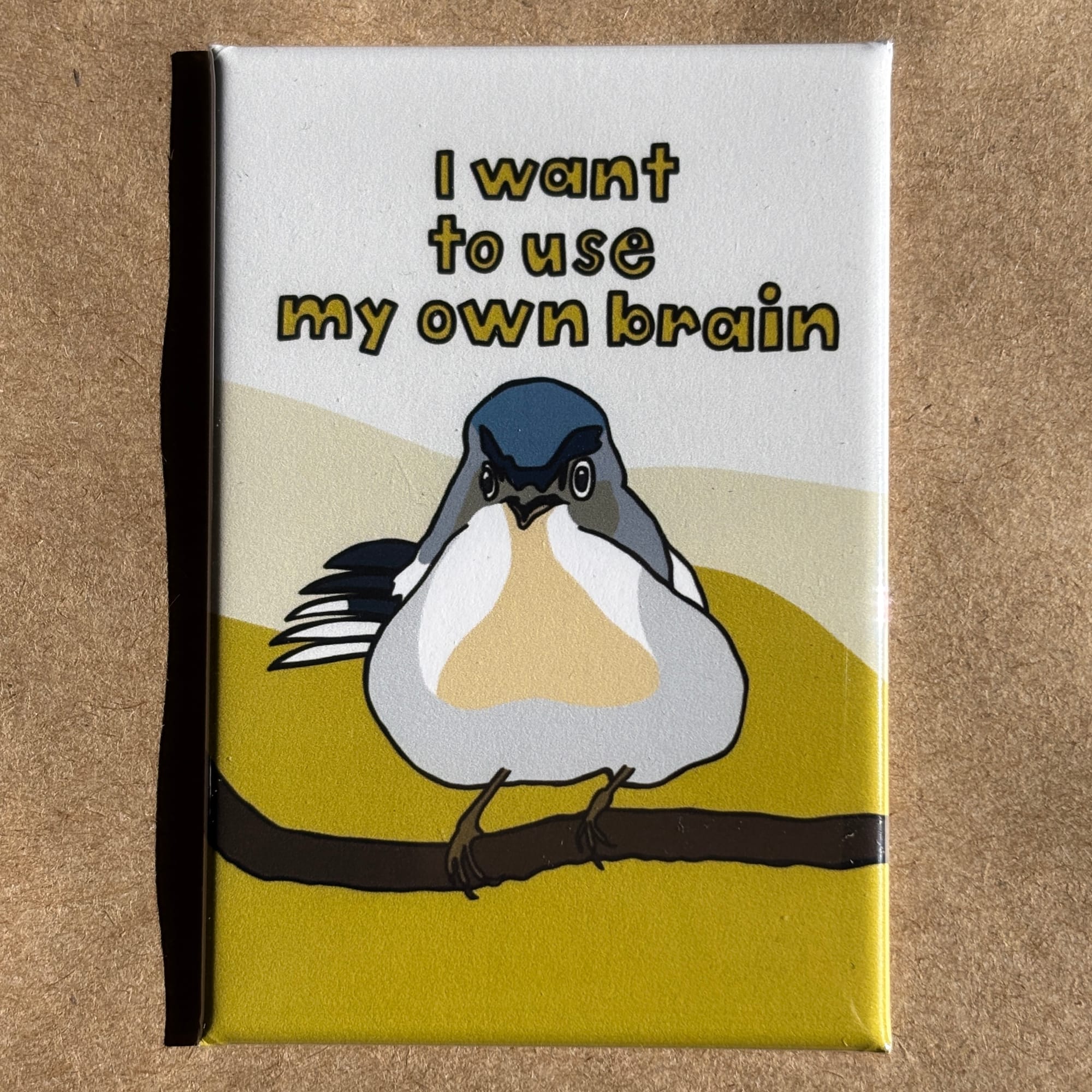 original art by AnneArchy of a bird perched on a branch with hand lettering of the words "I want to use my own brain."