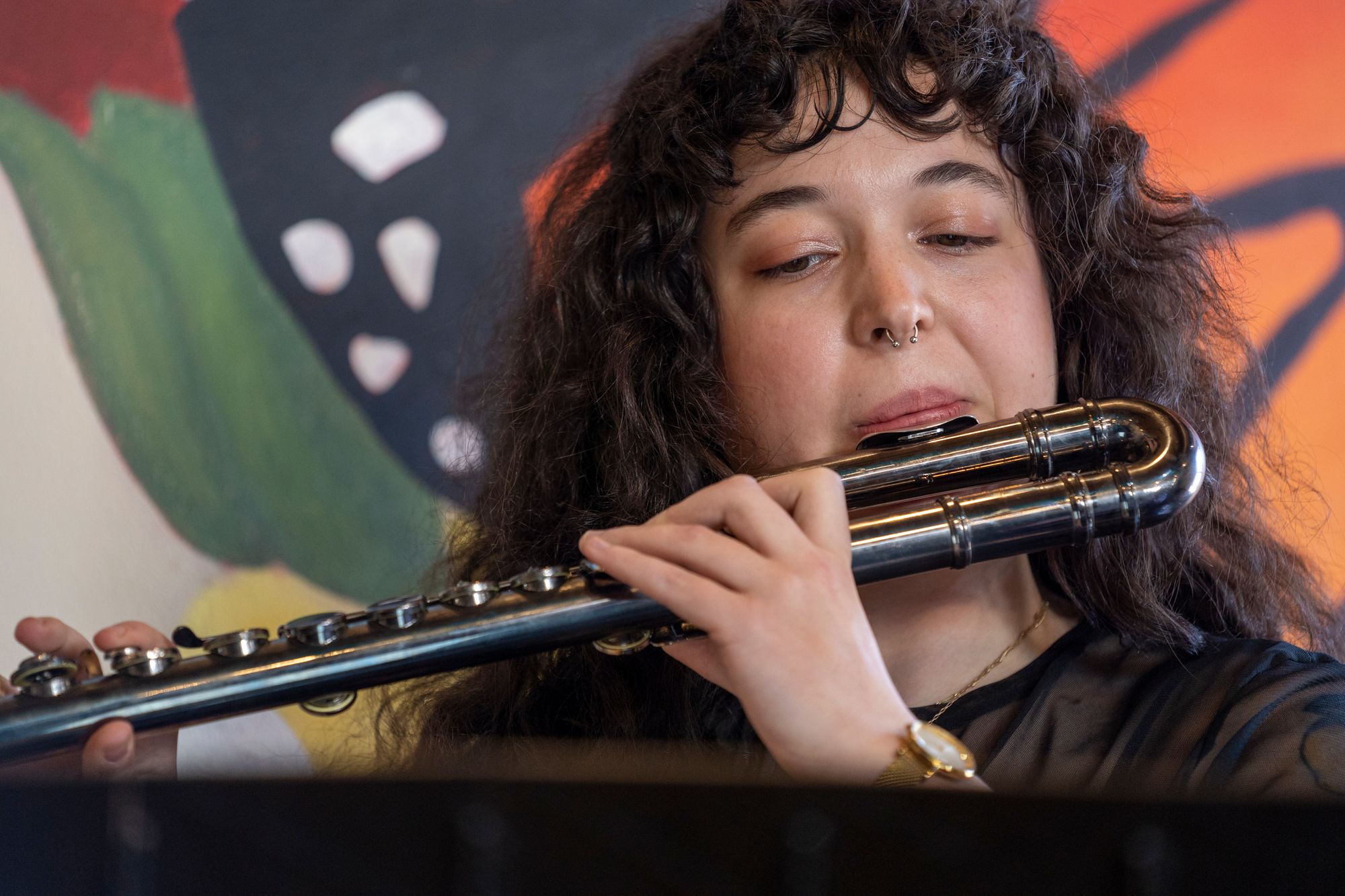 Image of a woman playing the flute