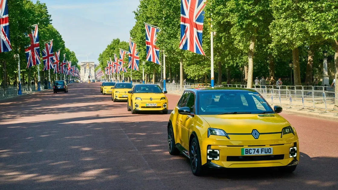 Yellow electric Renault 5s drive down the Mall in London.
