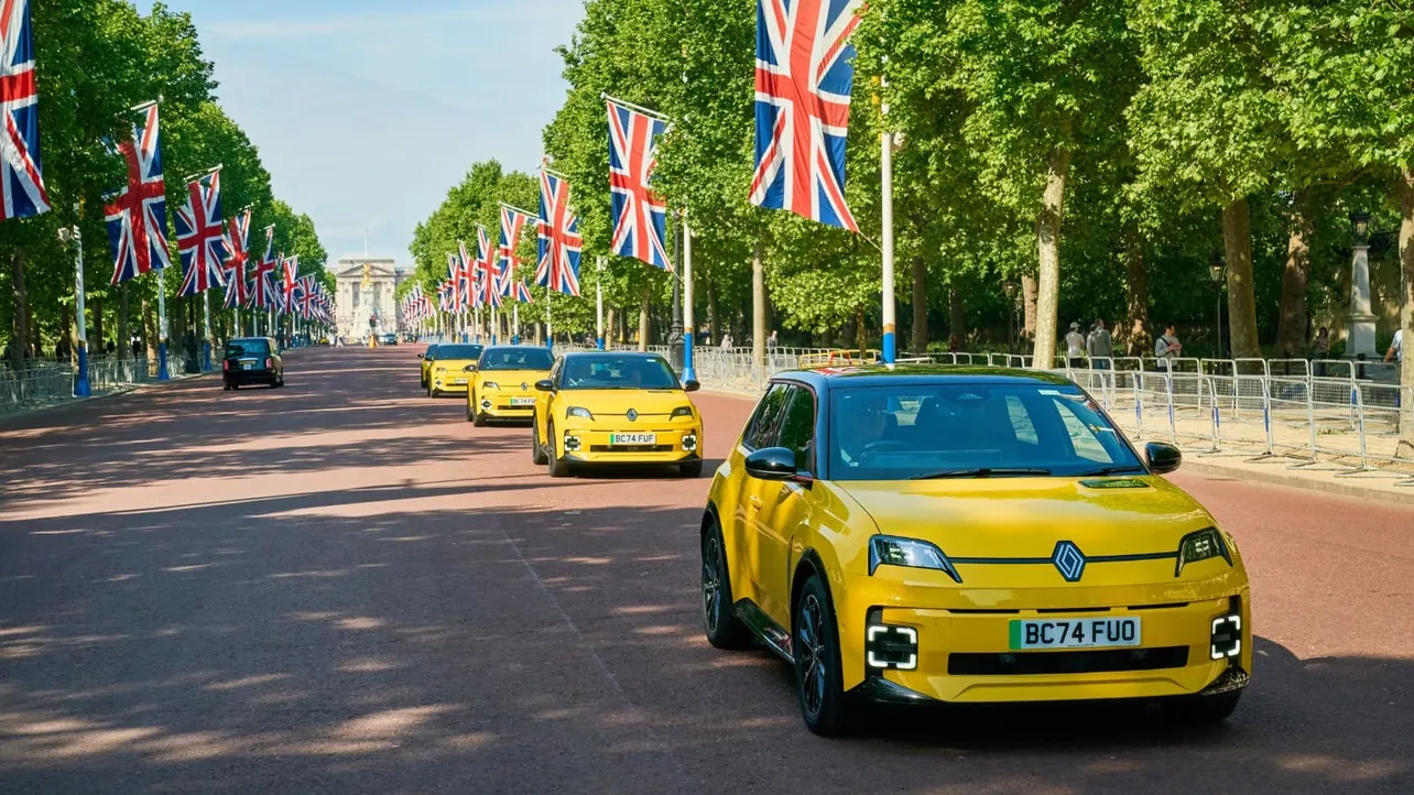 Yellow electric Renault 5s drive down the Mall in London.