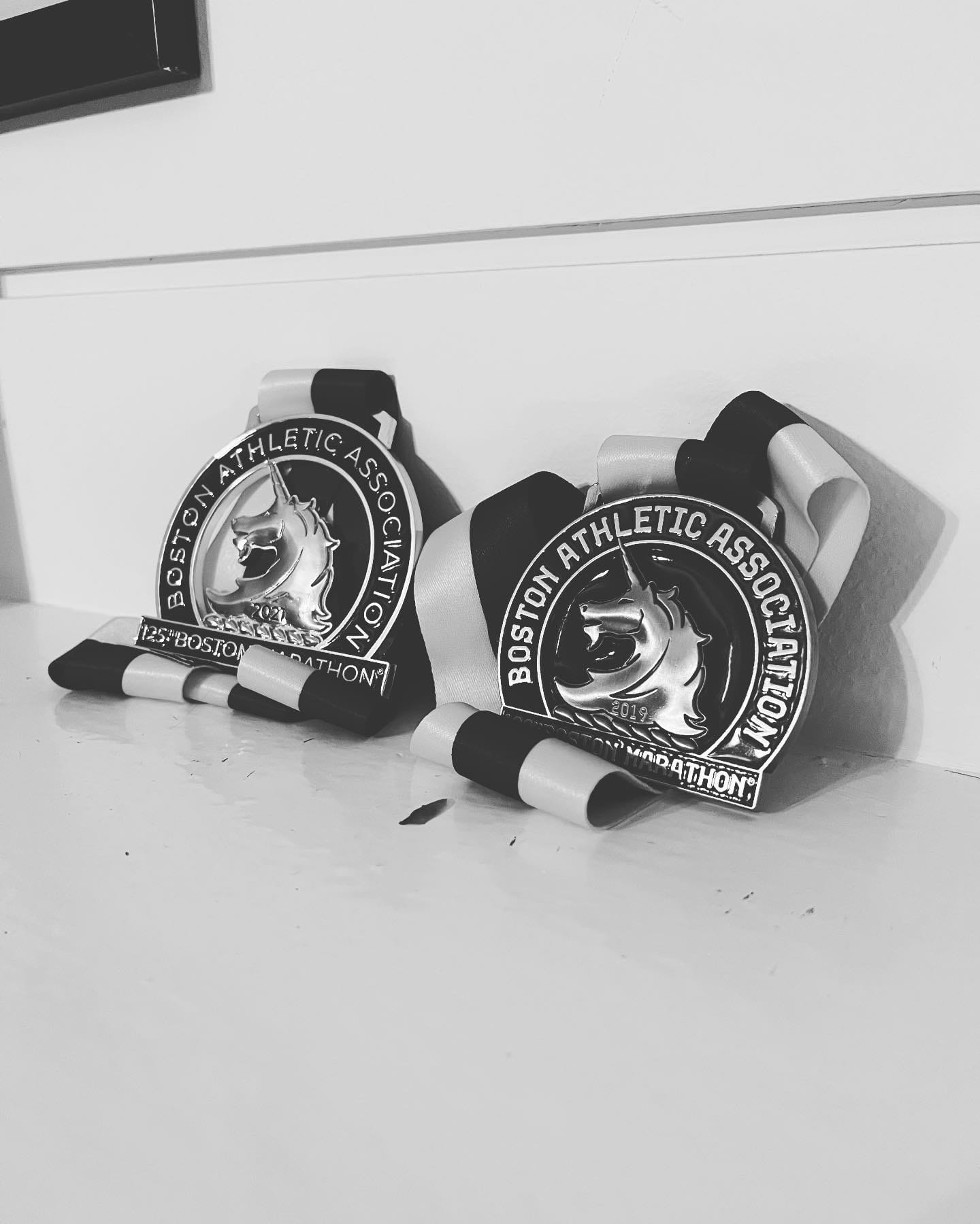 My Boston Marathon medals from 2019 and 2021 (right to left). Photo by Me.