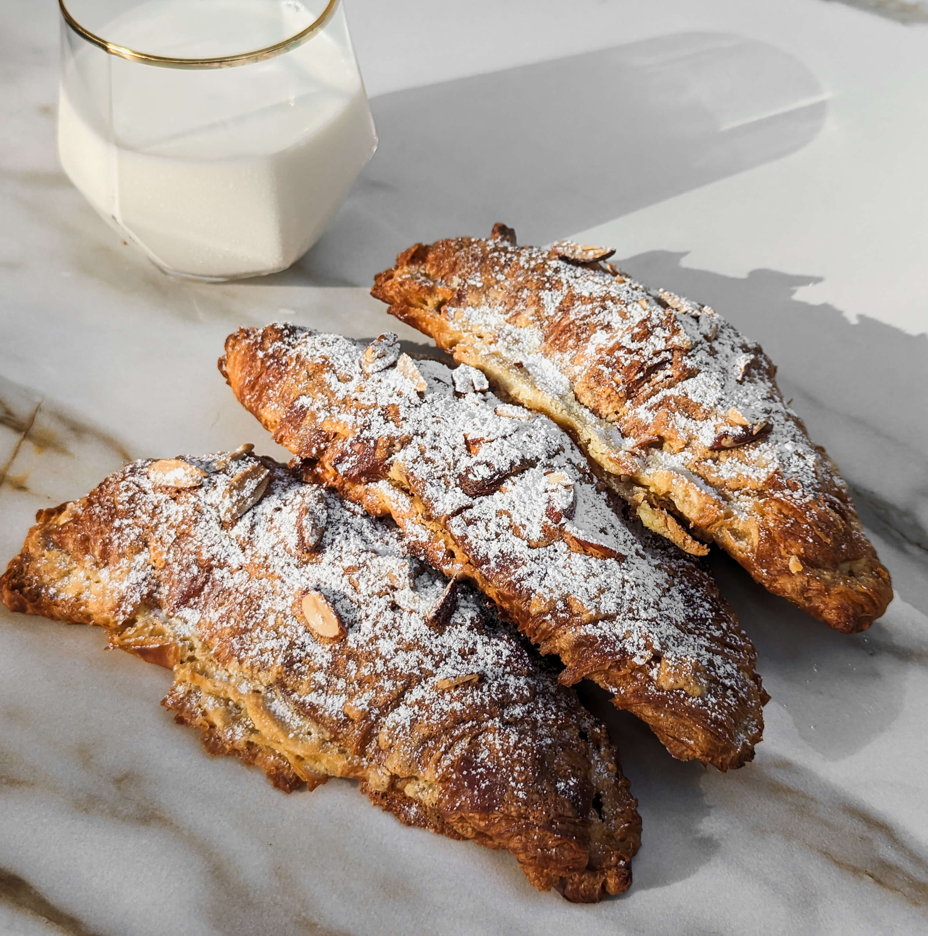 3 almond croissants with milk