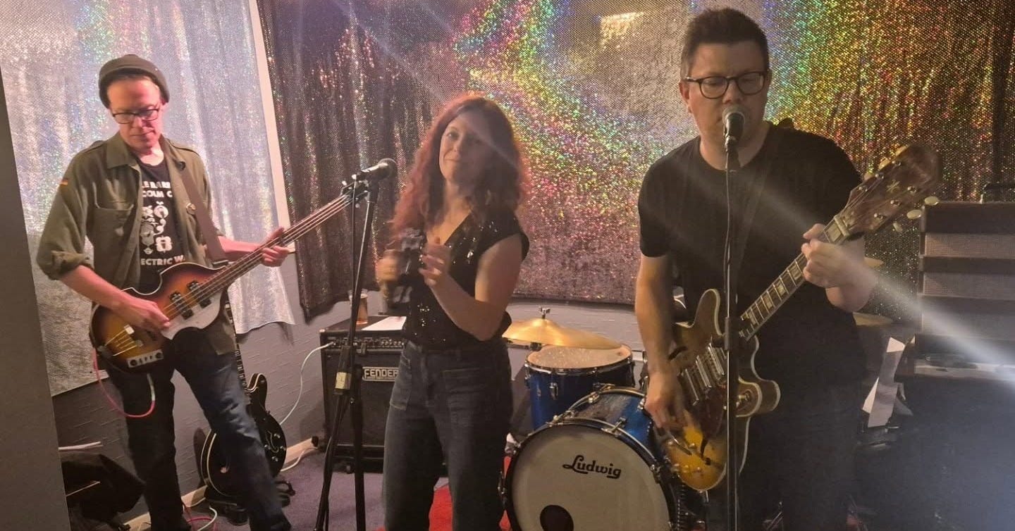 May be an image of guitar and saxophone