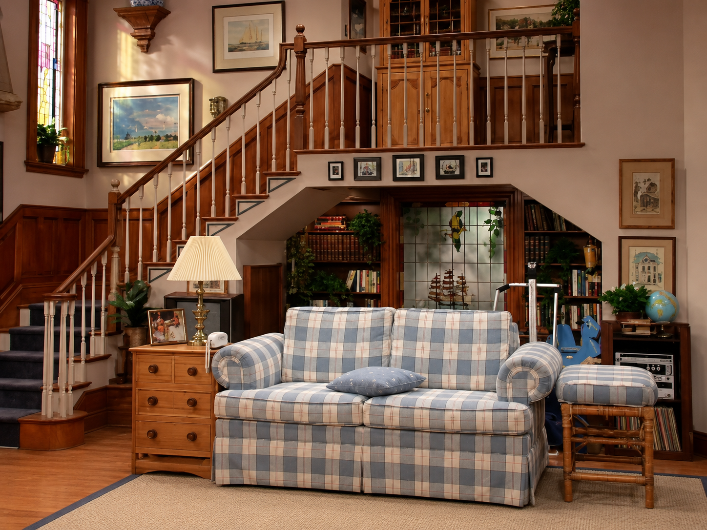 Warm late-1980s San Francisco family living room with bay windows and a rear staircase