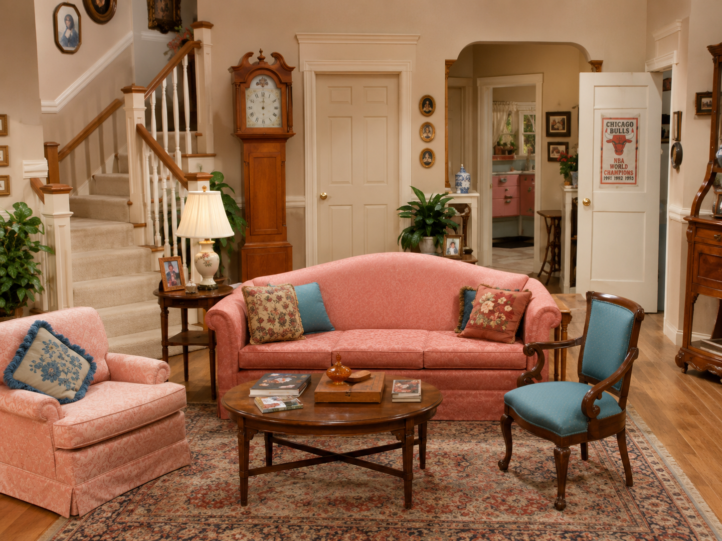 Comfortable early-1990s Chicago family living room with a front door and staircase