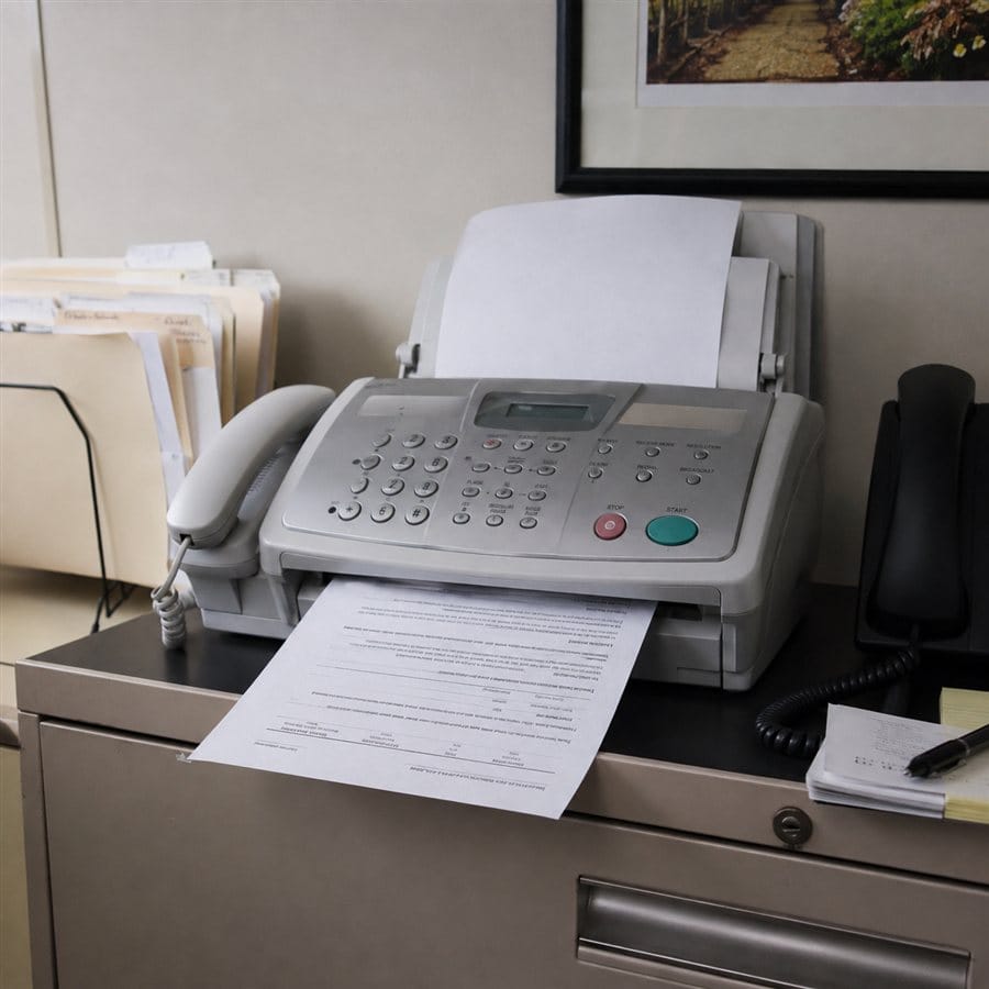A desktop fax machine with telephone handset