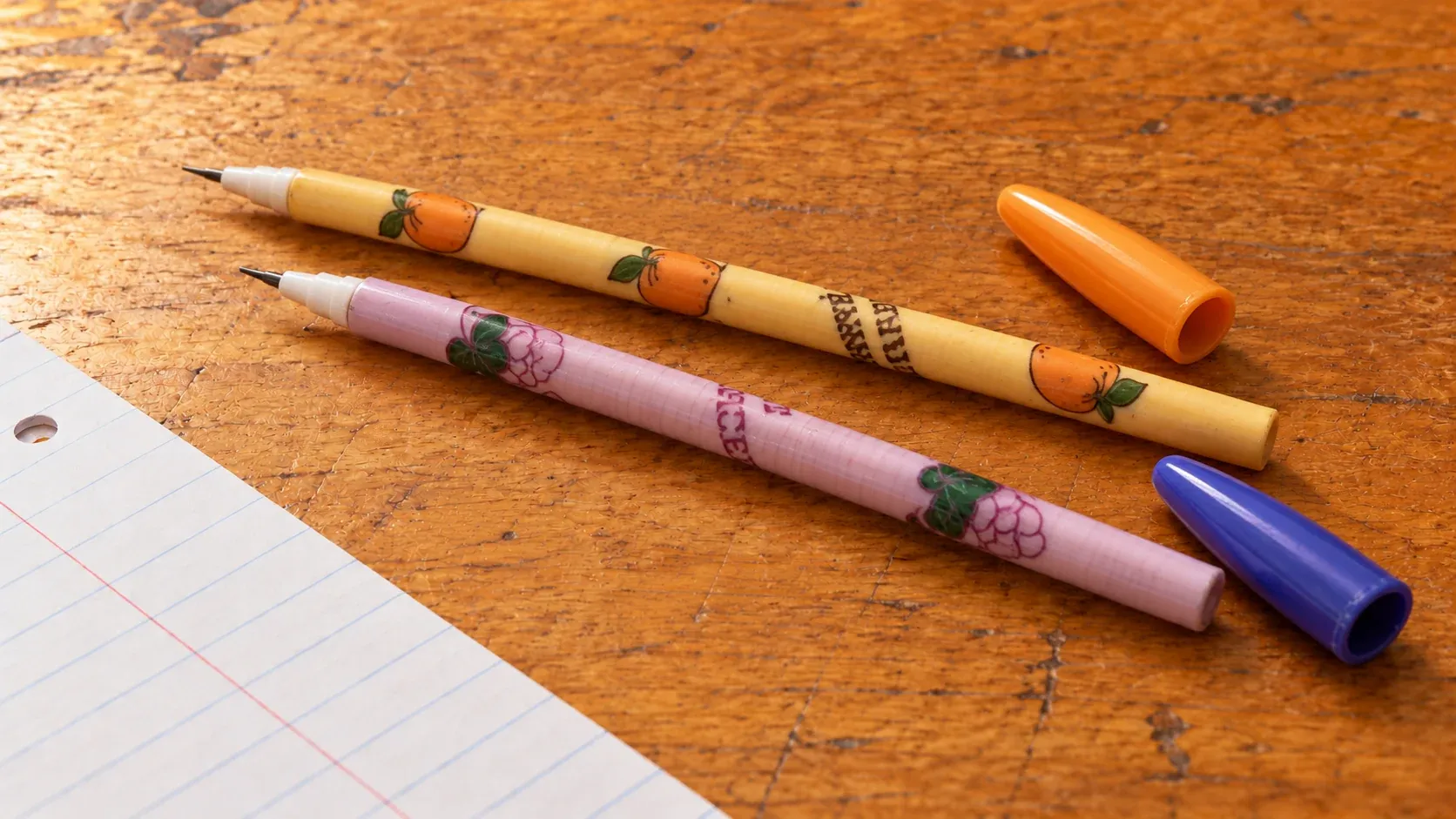 Fruit-patterned Bensia pop-a-point pencils with removable caps.