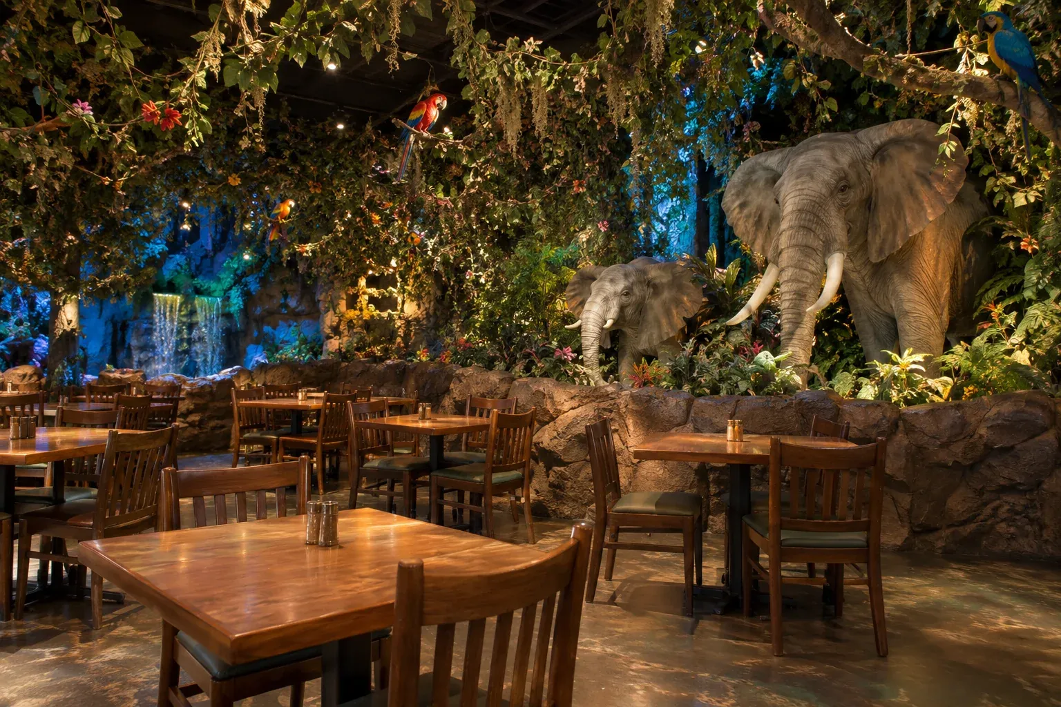 Recreated jungle-themed dining room with hanging vines and animatronic elephants.