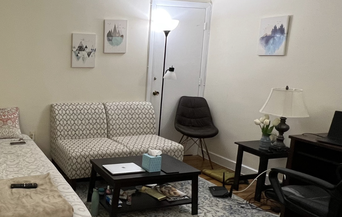 white sofa seats in a small studio apartment