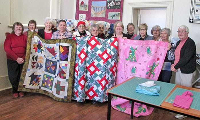 NYP Quilters give cancer the prick