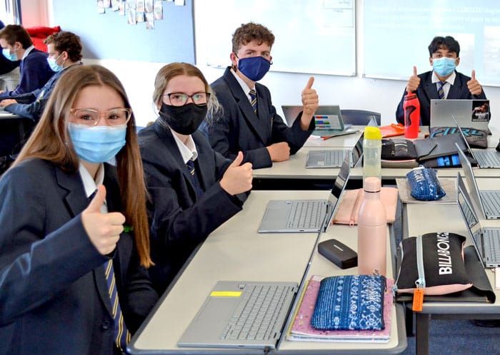 Masked-up students back in class post image
