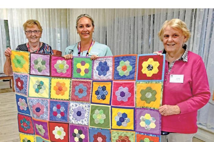 U3AYP Sew and Yarn group donate quilts post image
