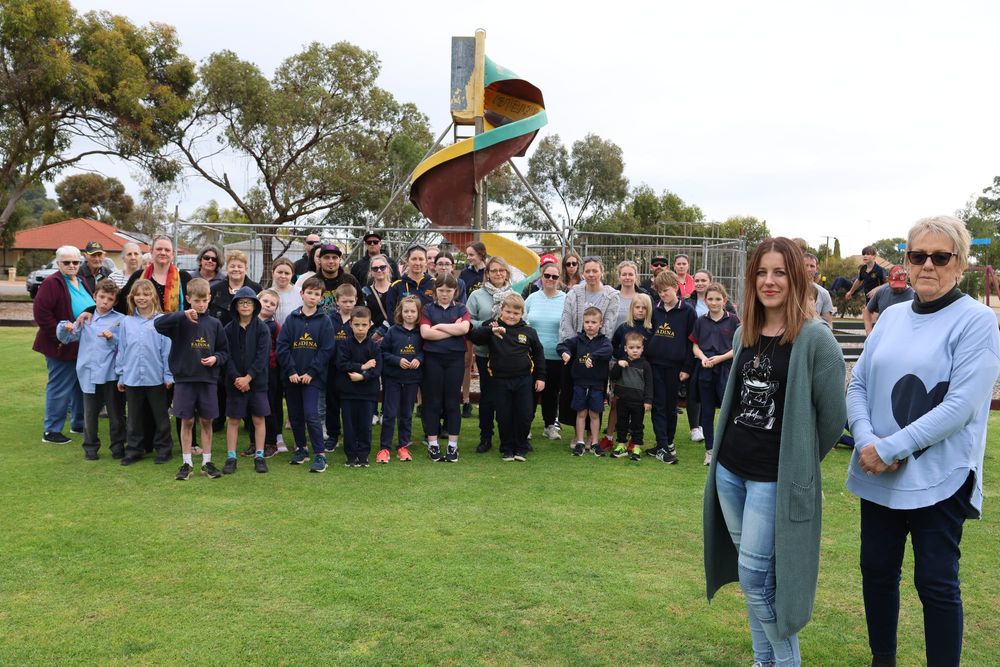 Residents rally to retain iconic slide post image