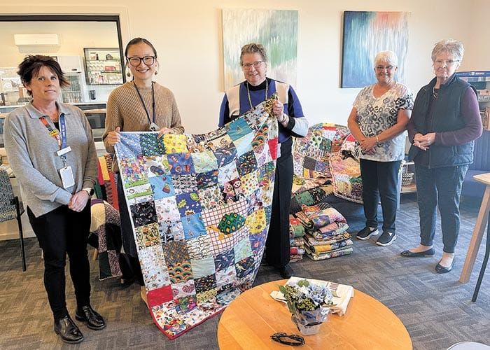 Crafting quilts to care for locals in need post image