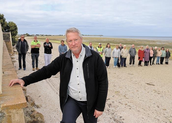 Standing up against wall post image