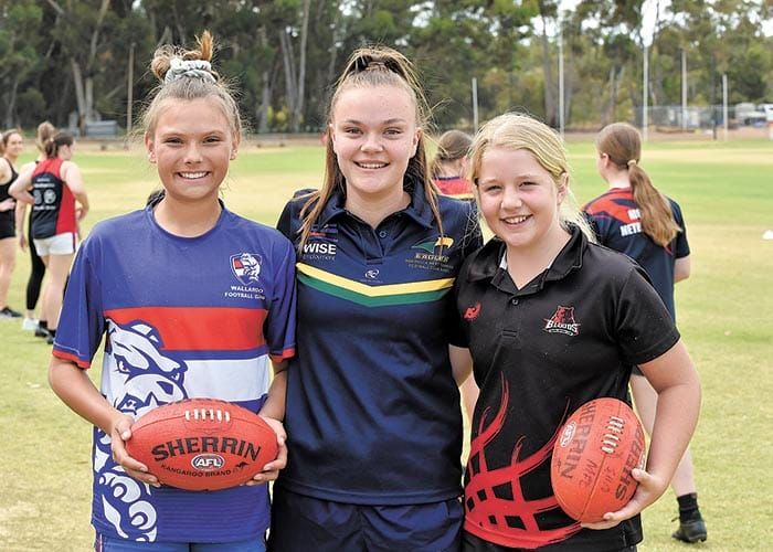 Girls flock to footy try outs post image