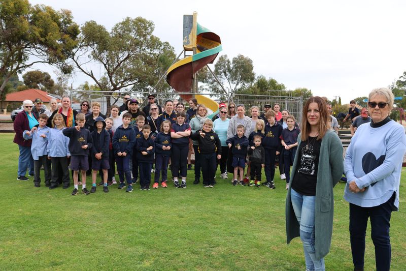 Residents rally to retain iconic slide post image