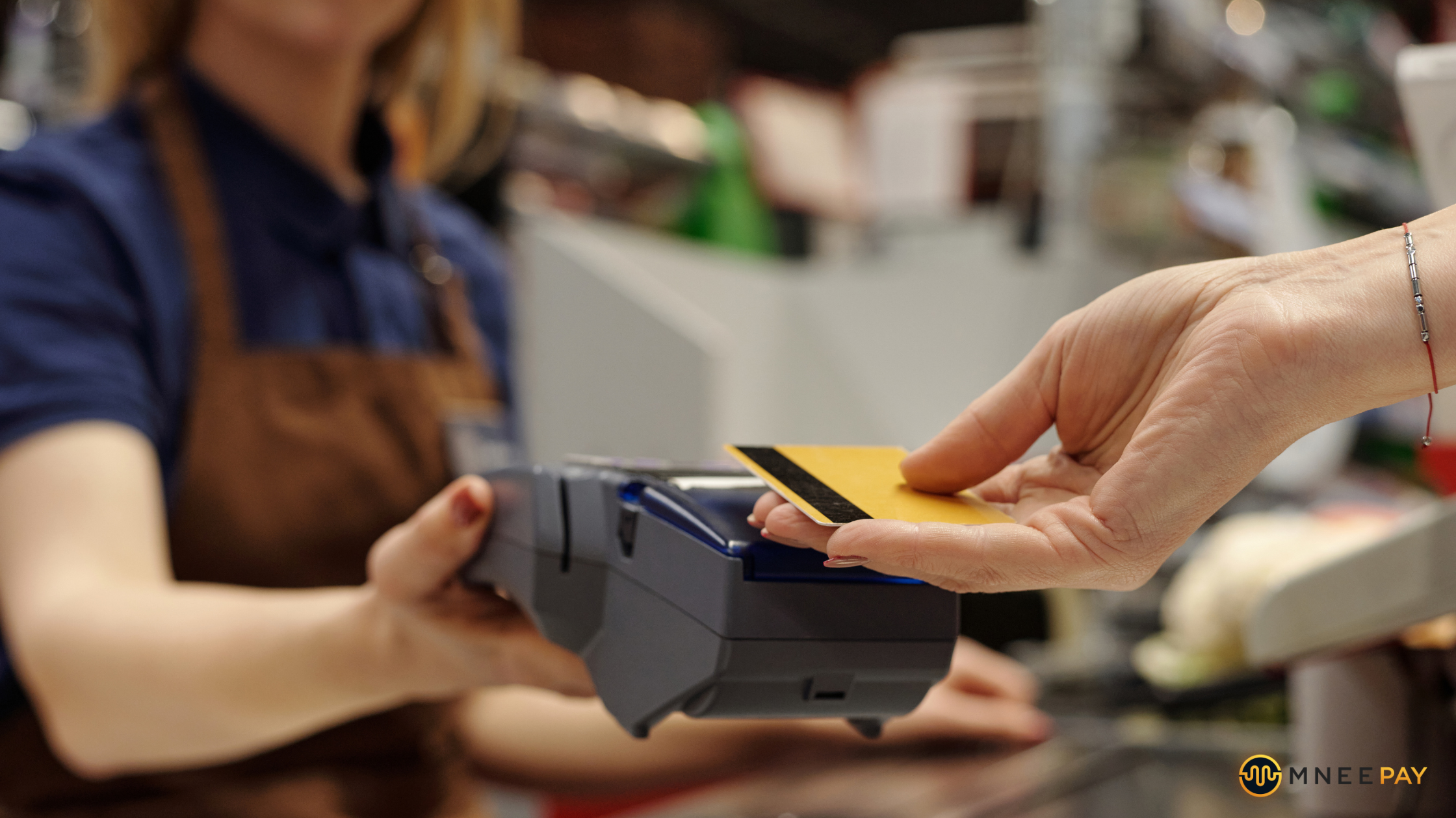 Customer making a credit card payment on a POS machine, illustrating chargebacks in retail