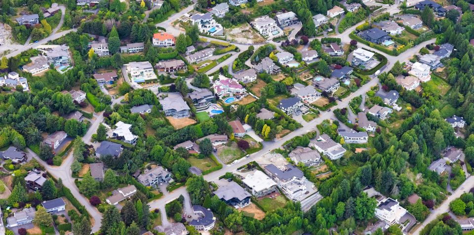 An aerial view of low-density housing reveals how expanding home sizes and generous plots quietly shape land consumption, infrastructure demand, and long-term environmental impact.