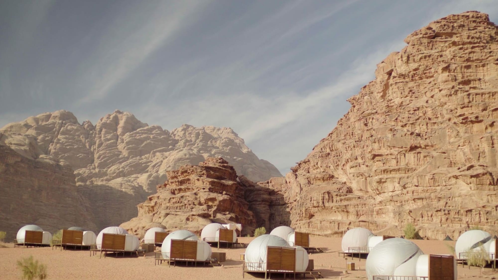 Sleeping under the stars in transparent bubble tents in Jordan's Wadi Rum