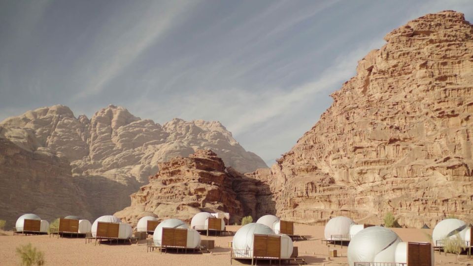Sleeping under the stars in transparent bubble tents in Jordan's Wadi Rum