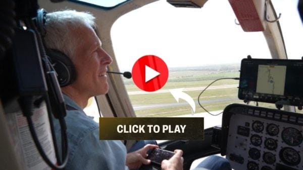 Smiling man in helicopter cockpit