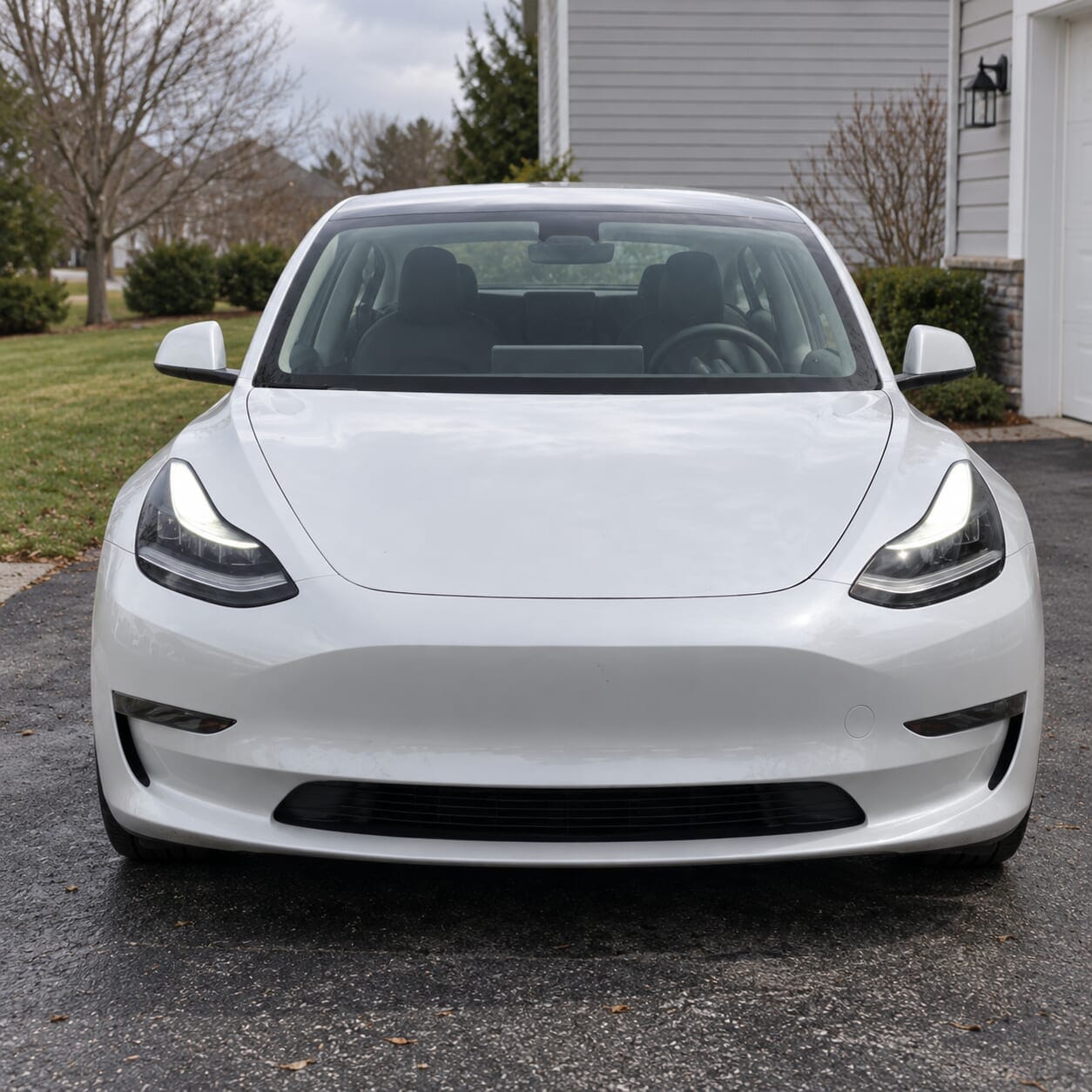 Front view of a white Tesla car