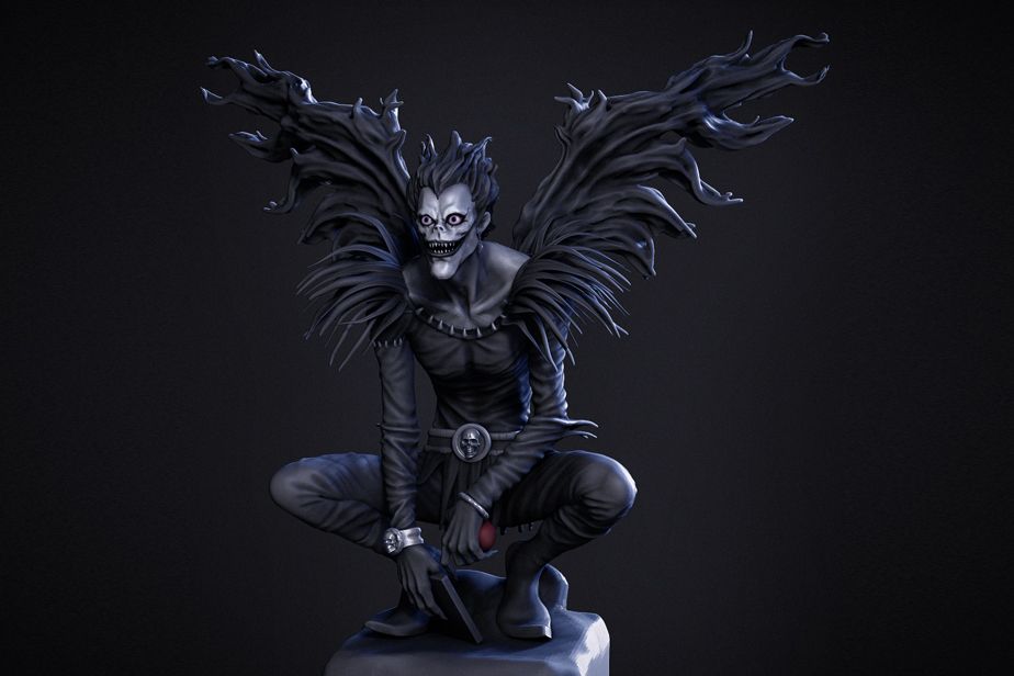 A statue of a person with wings
Description automatically generated